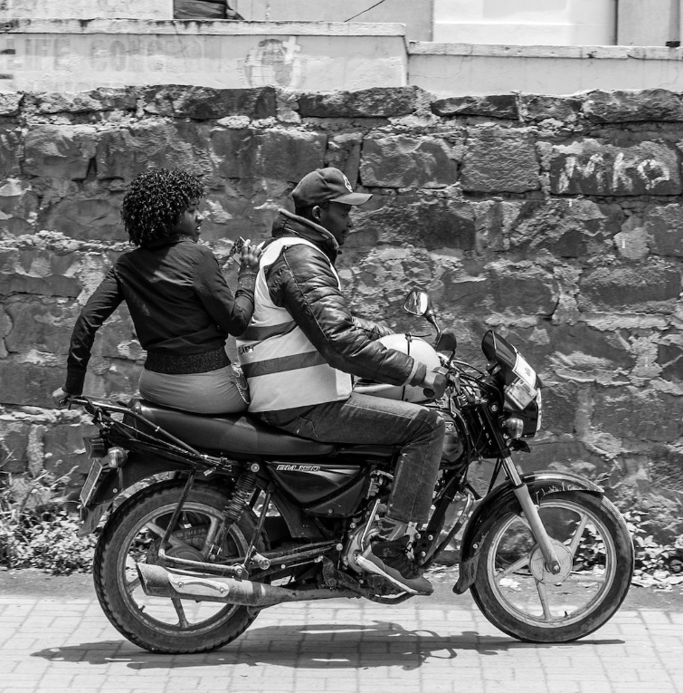 Man and Woman Riding Motorcycle Together